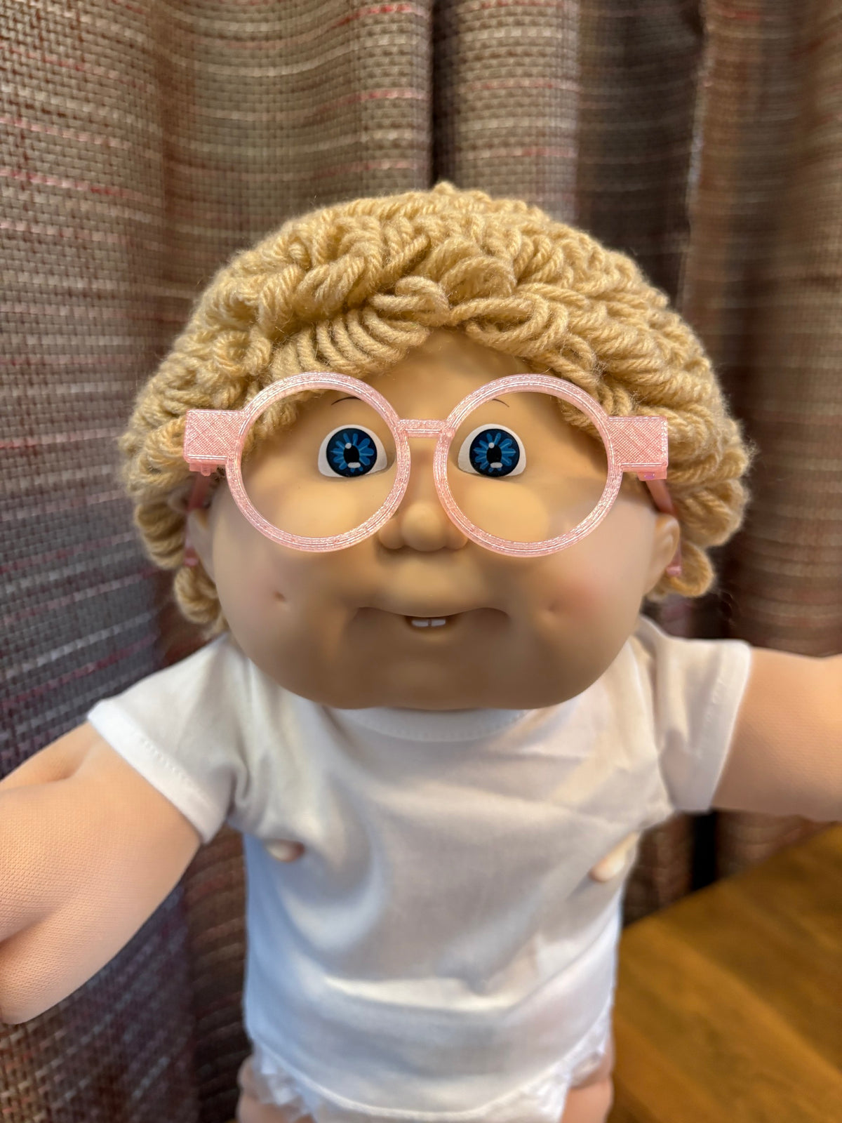 Pink round glasses on a 16 inch Cabbage Patch Kids doll