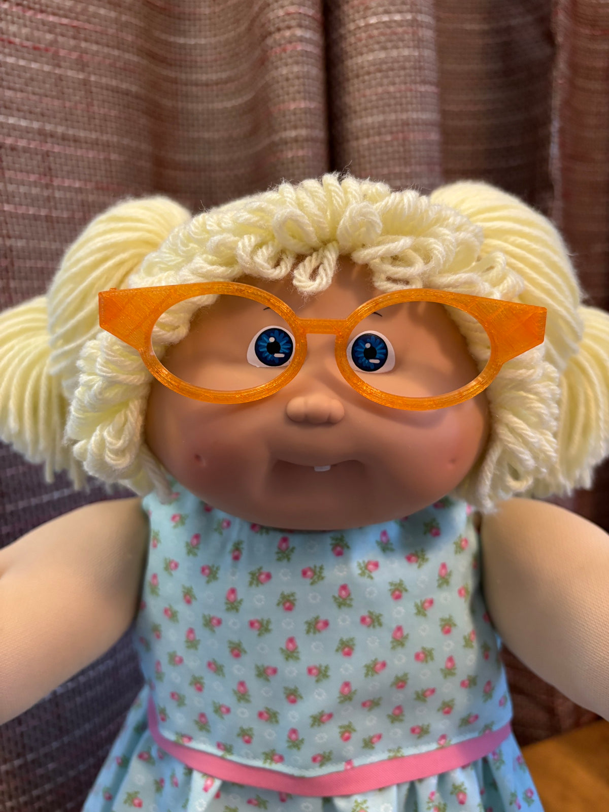 Orange cat eye glasses on a 16 inch Cabbage Patch Kids doll