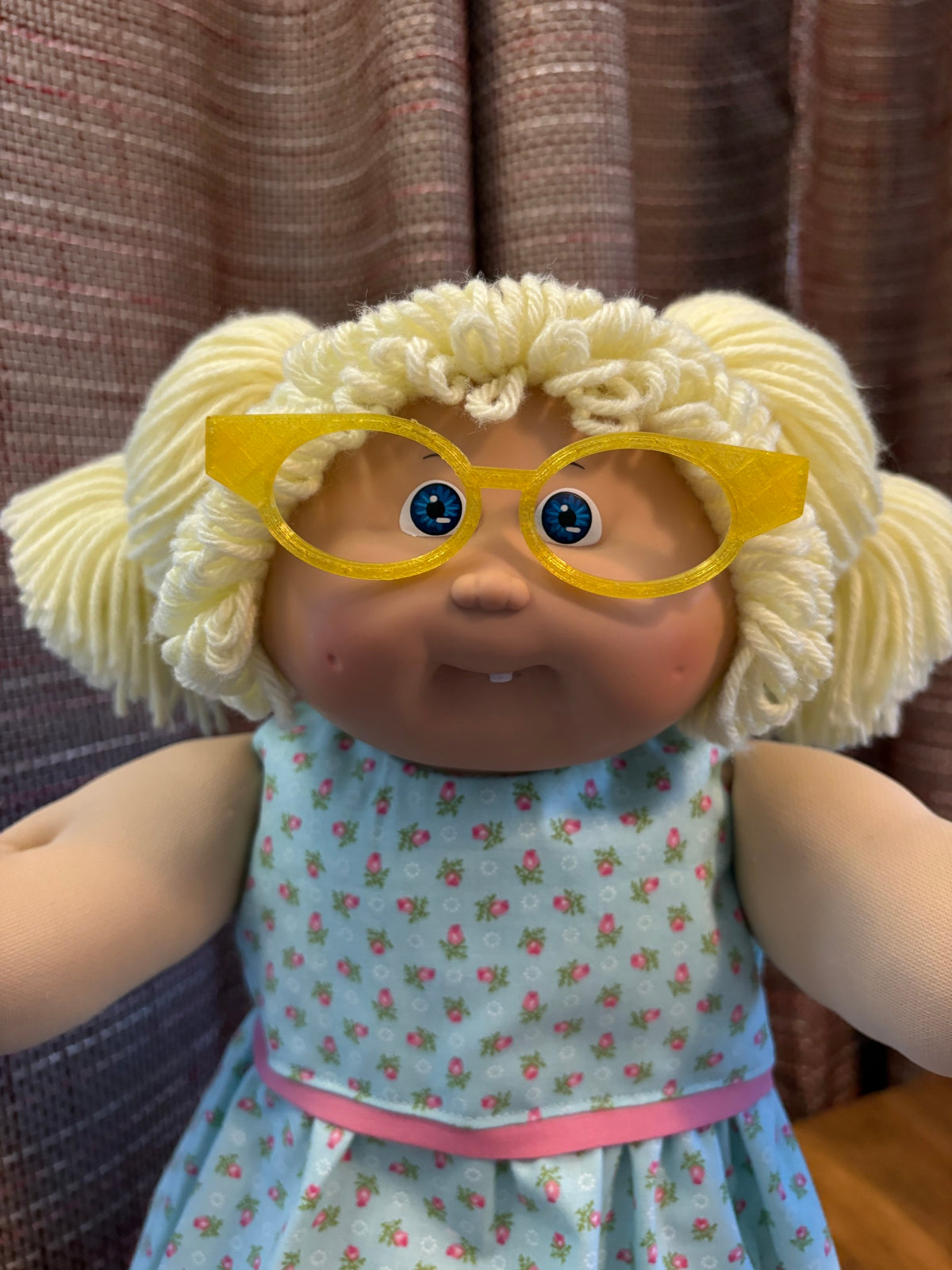 Yellow cat eye glasses on a 16 inch Cabbage Patch Kids doll