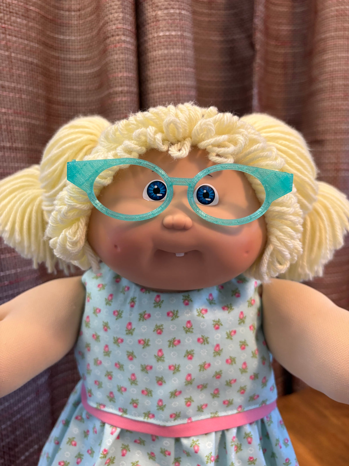 Teal cat eye glasses on a 16 inch Cabbage Patch Kids doll