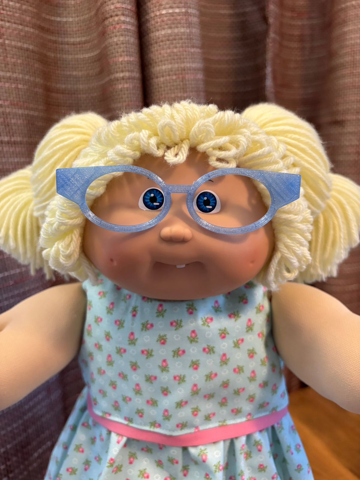 Blue cat eye glasses on a 16 inch Cabbage Patch Kids doll