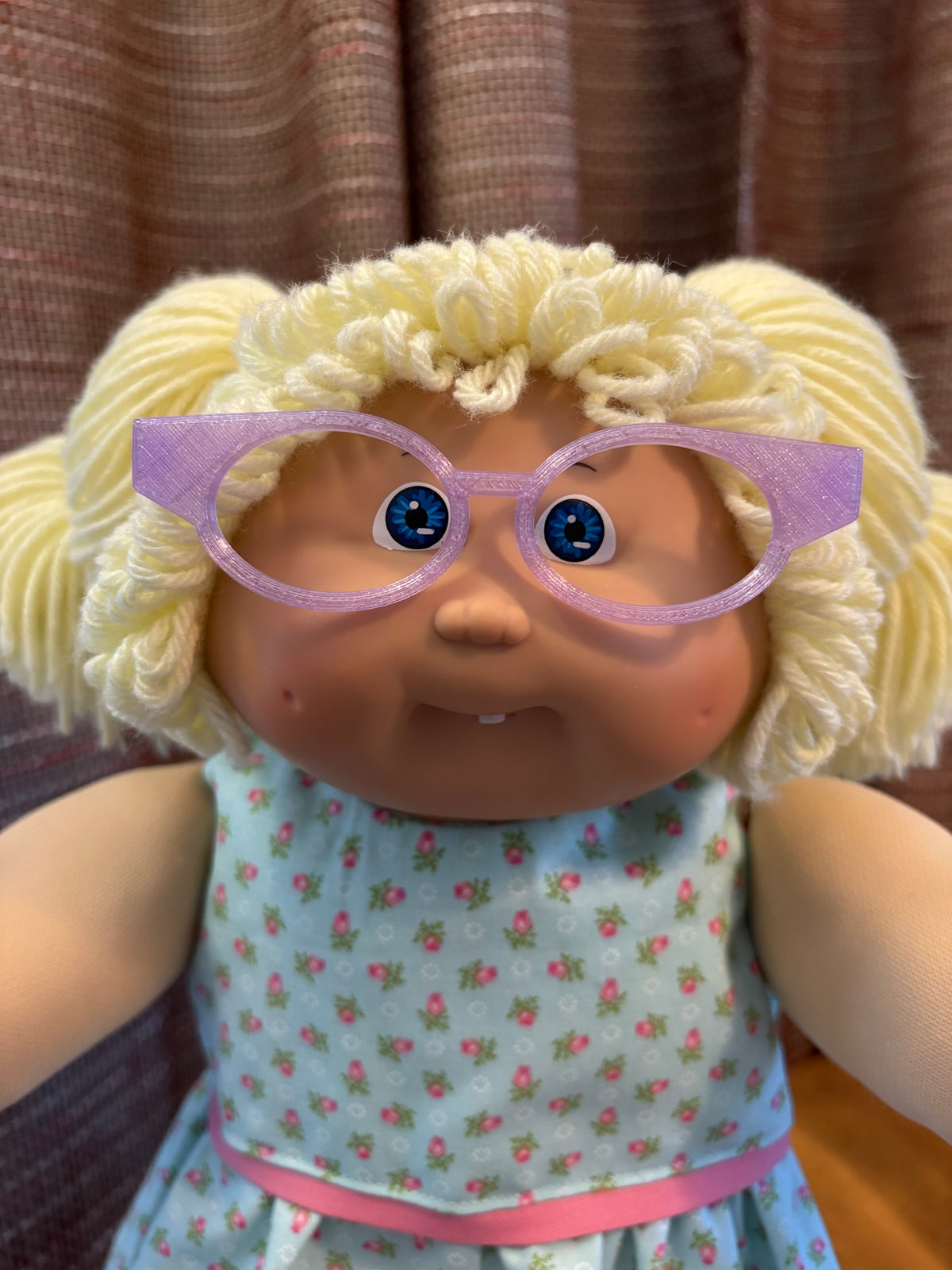 Purple cat eye glasses on a 16 inch Cabbage Patch Kids doll