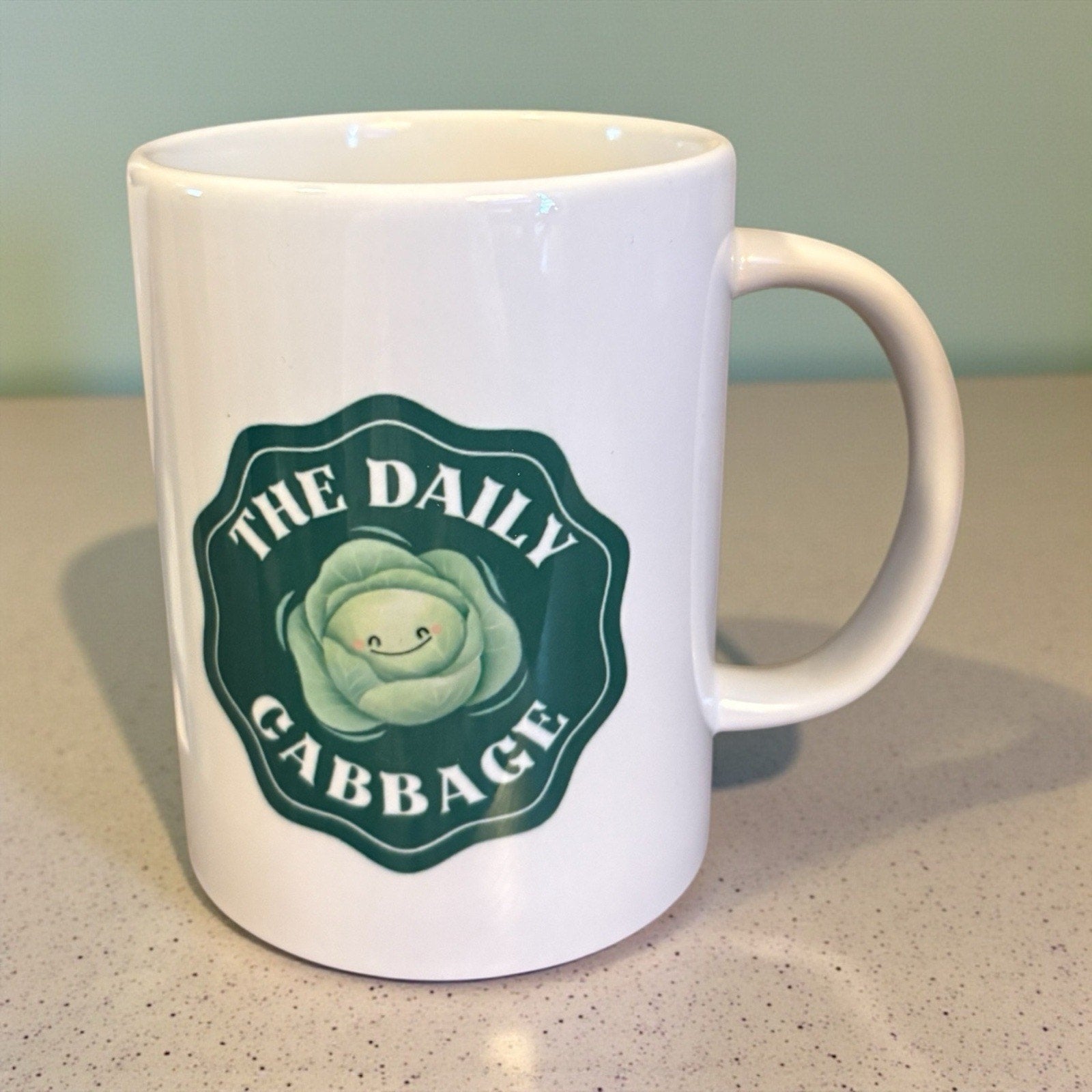 The Daily Cabbage Double Sided Logo 12 Oz Drink Coffee Mug